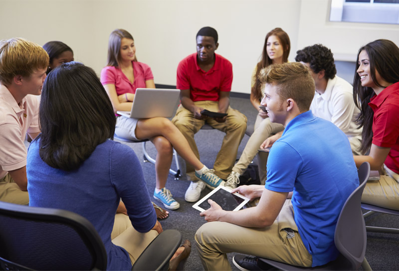High School Students Taking Part in Group Discussion Circle