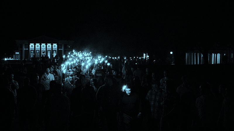 Blue-tinted photo of a far right rally.