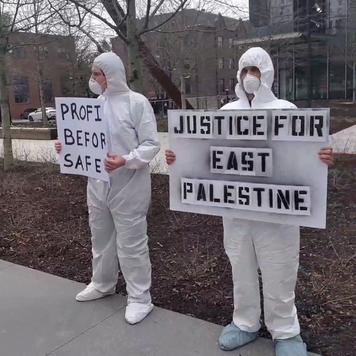 NJP affiliates protesting outside of Norfolk Southern’s corporate headquarters in Atlanta, Georgia, wearing hazmat suits. A central claim by NJP, and others, is that the company and government is covering up the true environmental costs of the train derailment.