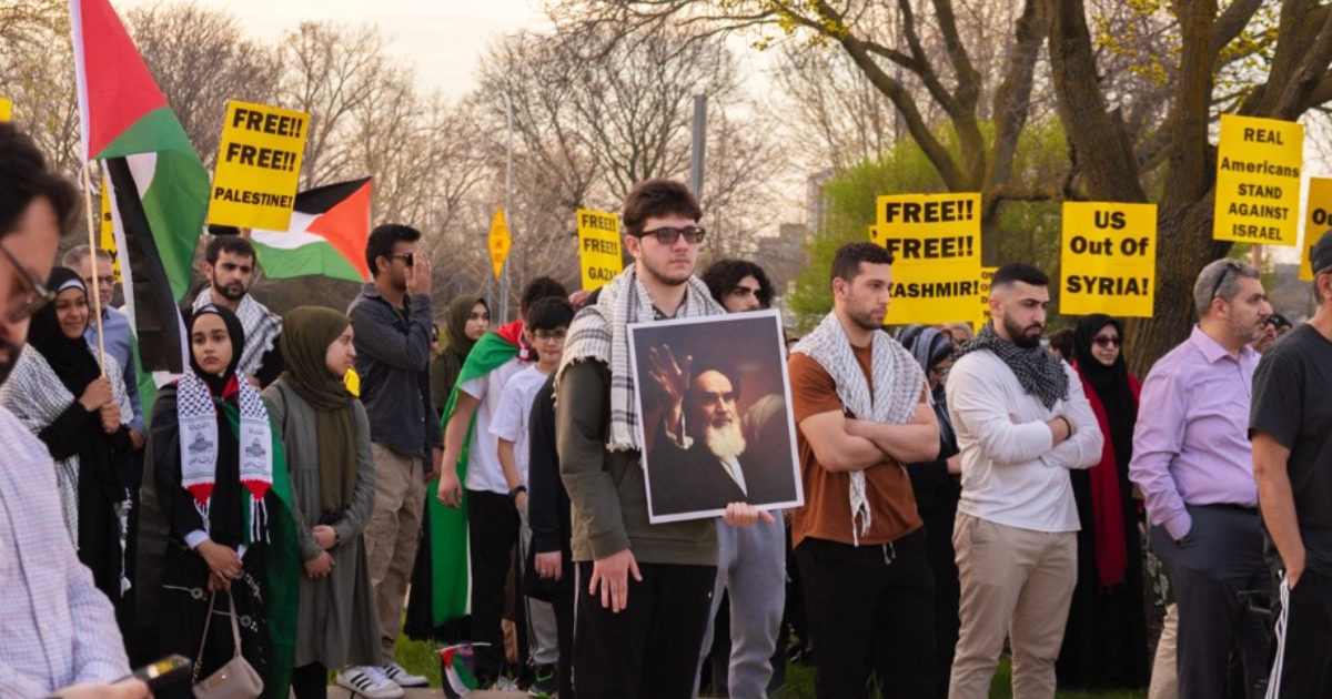 Detroit protestor holds image of Iranian Supreme Leader Ayatollah Khomeini
