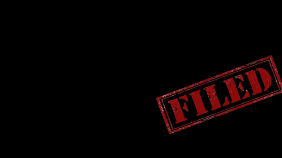 A Black background with a red stamp that reads, "FILED"