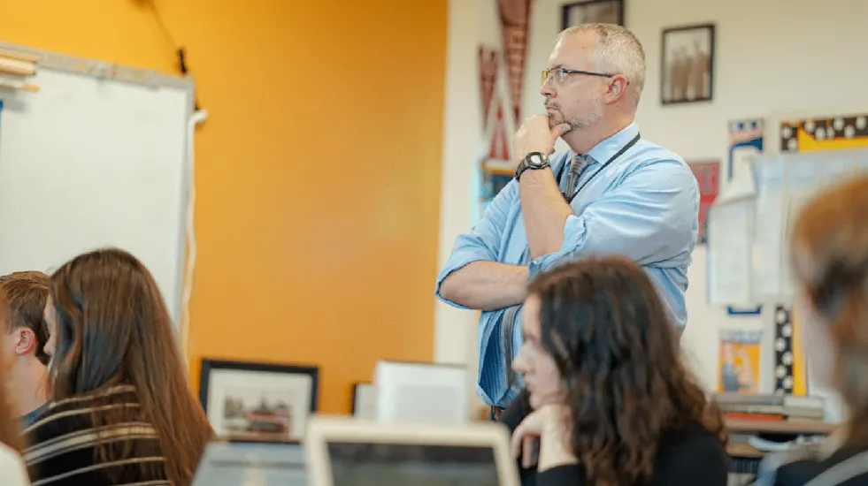 Teacher in classroom with students