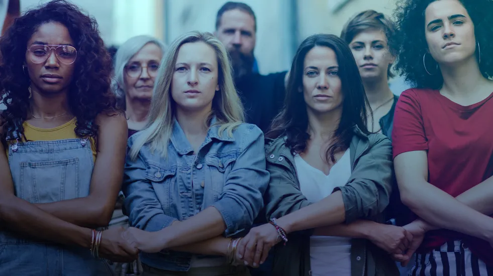 Diverse group of people holding hands