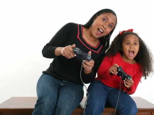 Mother and Daughter Play Video Game