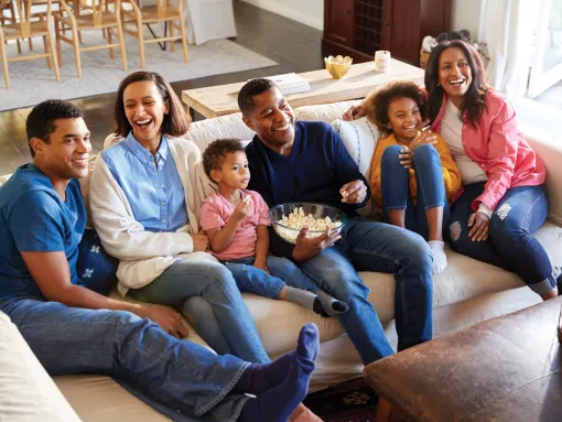 Three Generation Family Mixed Race Family Watching TV