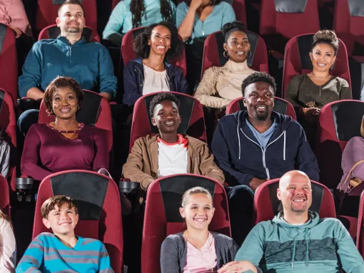 Multi-ethnic Audience Watching Movie in Theater