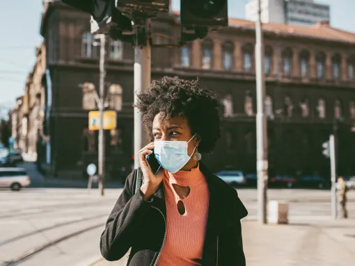 Portrait of a Young African American Woman with Mask on the Street