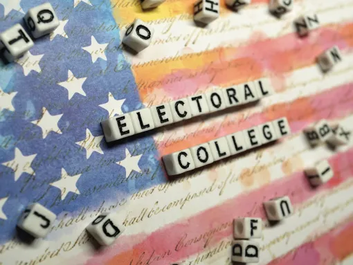 Electoral College Spelled with Dice against U.S. Flag