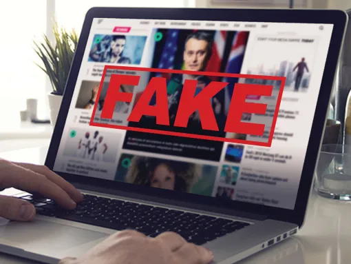 Fake News Computer Screen Reading Fake News