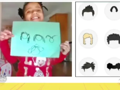 7-year old Morgan Bugg displays her drawing of hairstyles that reflect her identity
