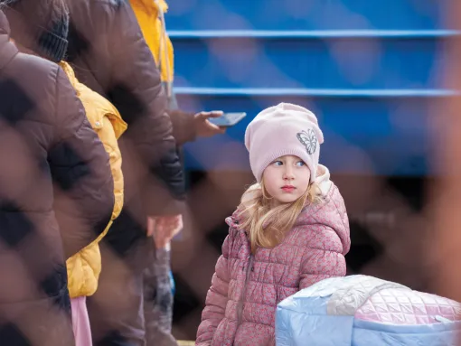 Ukrainian children fleeing Russian aggression in February 2022
