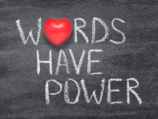"Words Have Power" phrase written on chalkboard with red heart