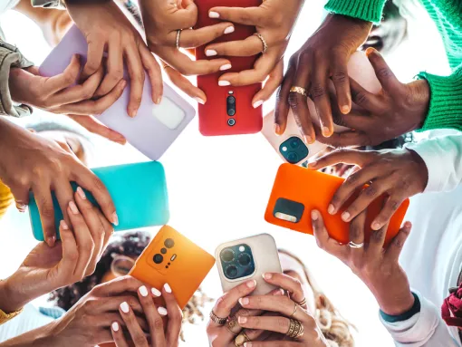 Group of young people using mobile phone