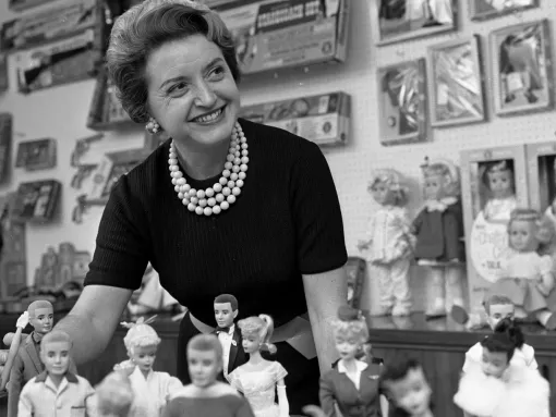 Ruth Handler Posing with Barbie Doll Collection