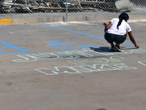 Girl Writes Justice for Mike Brown in Chalk Ferguson Missouri