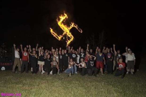burning swastika nsm