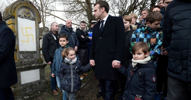 French President Emmanuel Macron toured a vandalized Jewish cemetery in Quatzenheim, France.