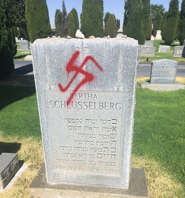 Headstones in a Jewish cemetery in El Paso, Texas vandalized with swastika graffiti in June, 2018. 