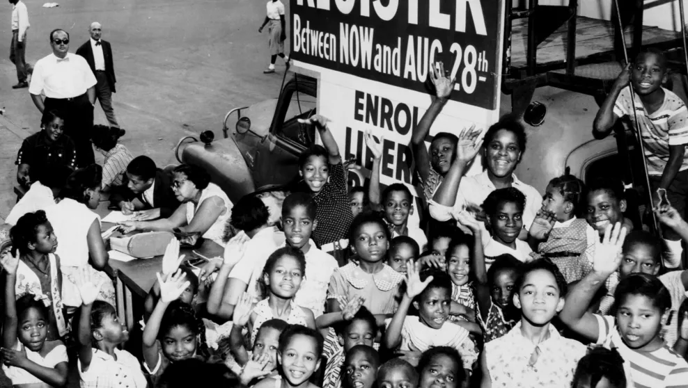 African American children encouraging people to register to vote