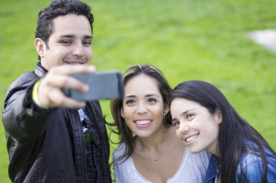 Family taking picture with mobile phone (iStock_000041774914)