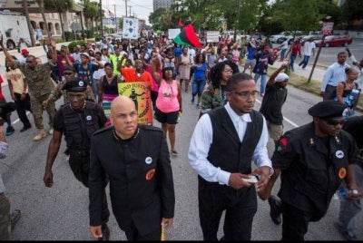 Hashim Nzinga (left) and Malik Zulu Shabazz (right) lead protestors in Charleston