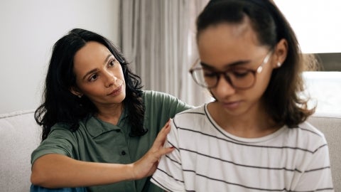 Parent consoling an upset child